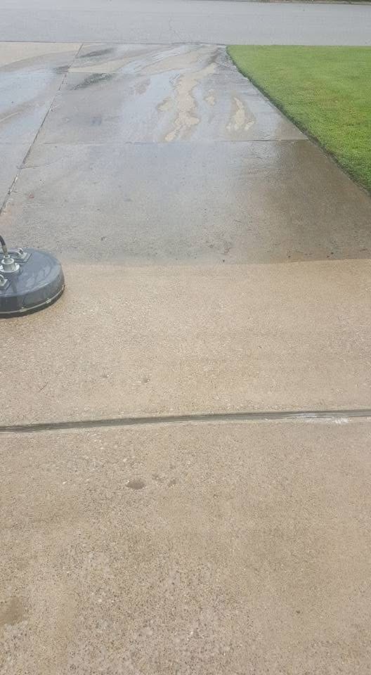 Driveway pressure washing in progress